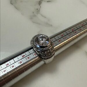 Jean Dousset graduated channel ring, sterling silver with CZ accents